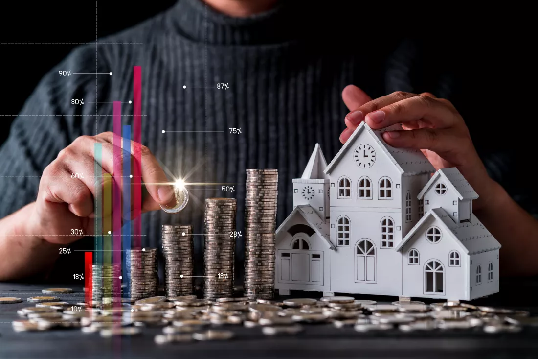 digital-composite-image-man-stacking-coins-by-model-house