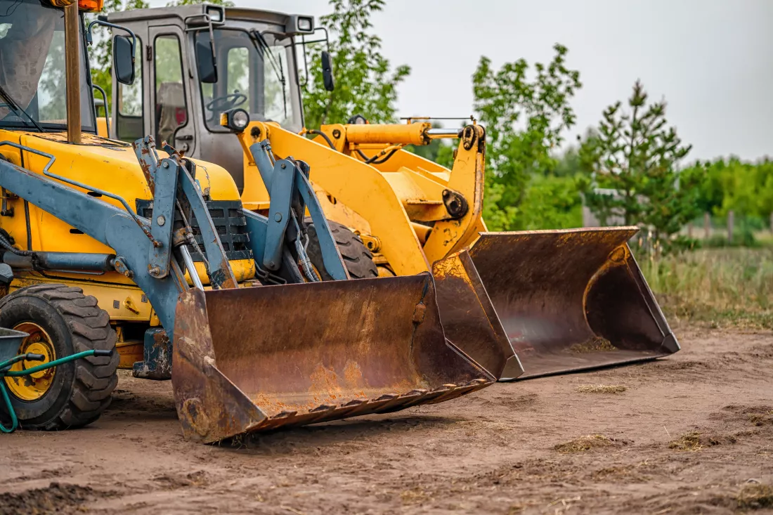tractors-excavators-are-standing-field-village